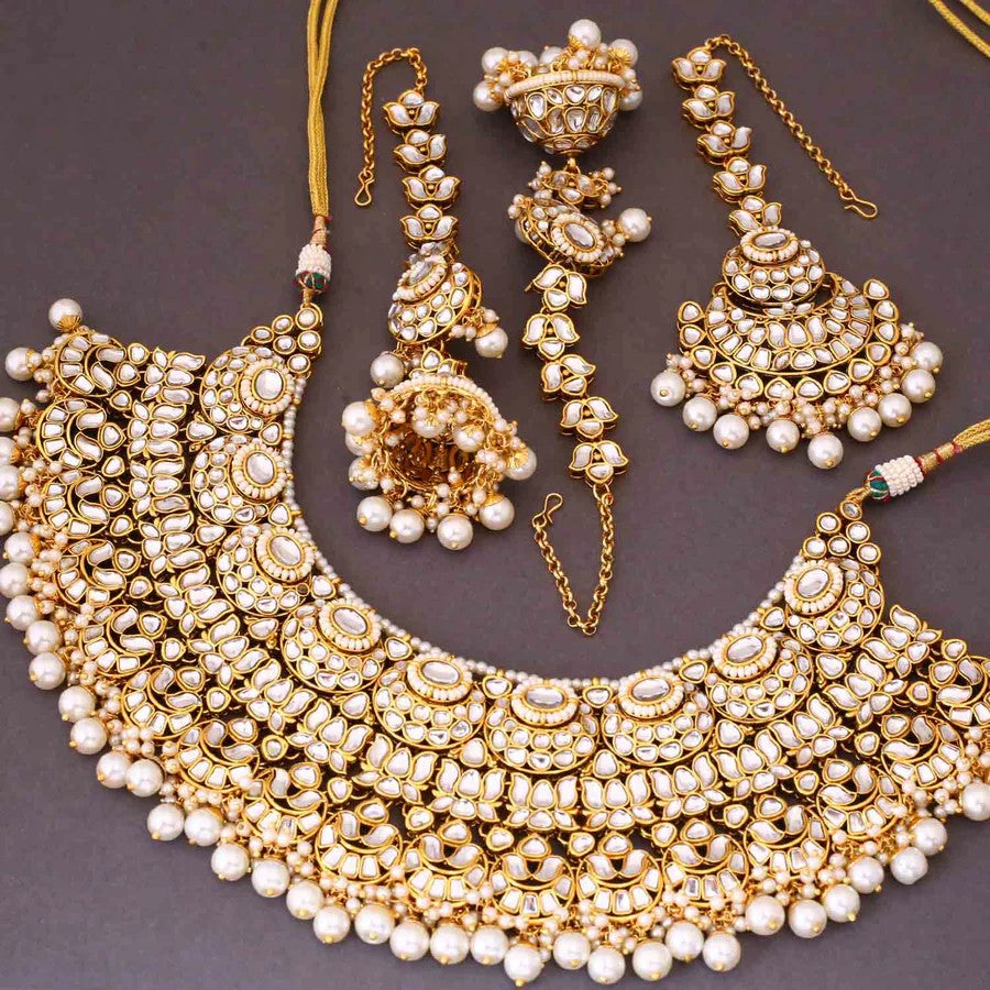 Taksh creation Gold - plated kundan Bridal jewellery set